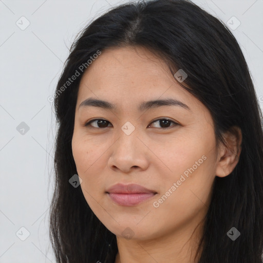 Joyful asian young-adult female with long  brown hair and brown eyes