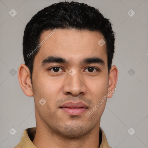 Joyful latino young-adult male with short  black hair and brown eyes