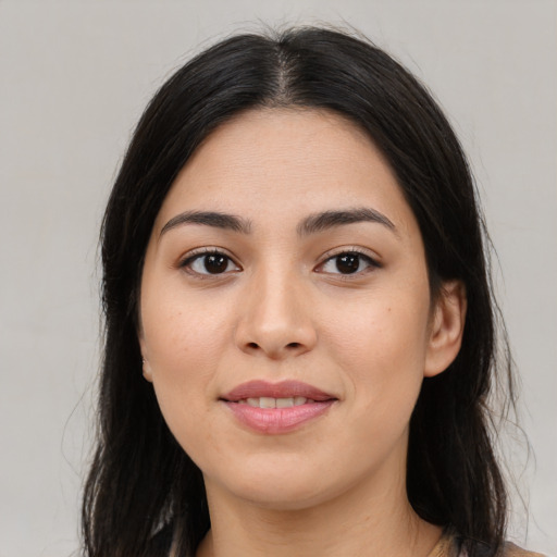 Joyful asian young-adult female with long  brown hair and brown eyes