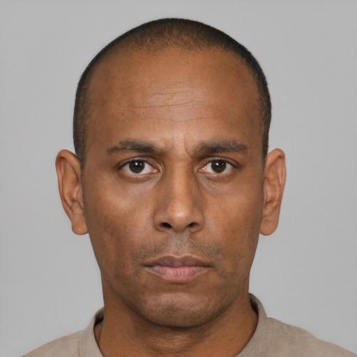 Neutral black adult male with short  black hair and brown eyes