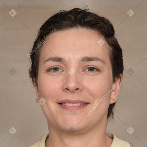 Joyful white adult female with short  brown hair and brown eyes