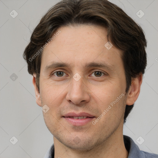 Joyful white adult male with short  brown hair and grey eyes