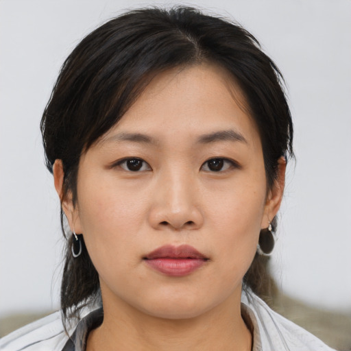 Neutral asian young-adult female with medium  brown hair and brown eyes
