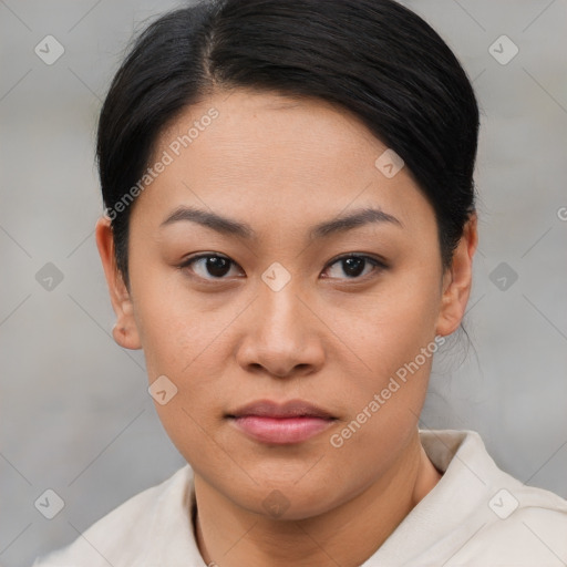 Joyful asian young-adult female with short  brown hair and brown eyes