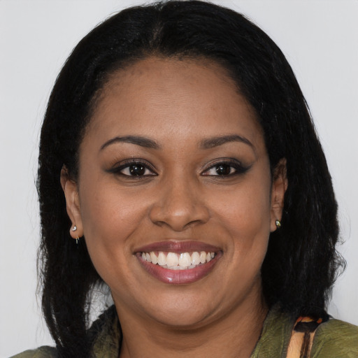 Joyful latino young-adult female with long  black hair and brown eyes