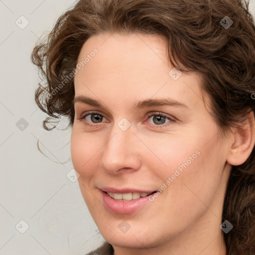 Joyful white young-adult female with medium  brown hair and green eyes