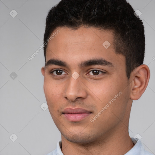 Joyful white young-adult male with short  black hair and brown eyes