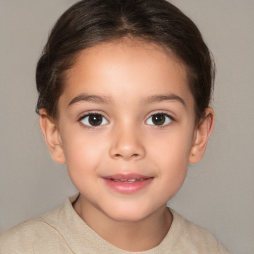 Joyful white child female with short  brown hair and brown eyes