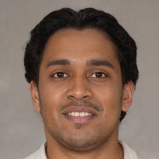 Neutral latino young-adult male with short  brown hair and brown eyes