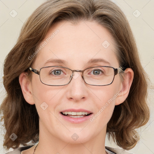 Joyful white adult female with medium  brown hair and blue eyes