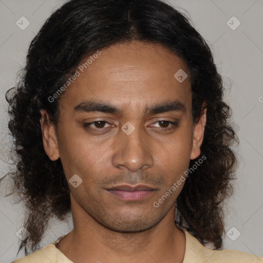 Joyful black young-adult male with medium  brown hair and brown eyes