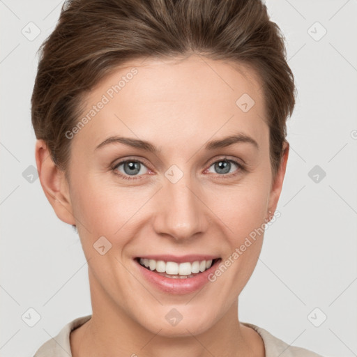 Joyful white young-adult female with short  brown hair and grey eyes