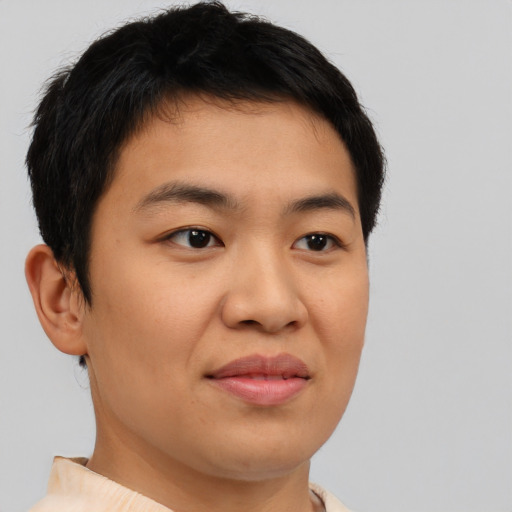 Joyful asian young-adult male with short  brown hair and brown eyes