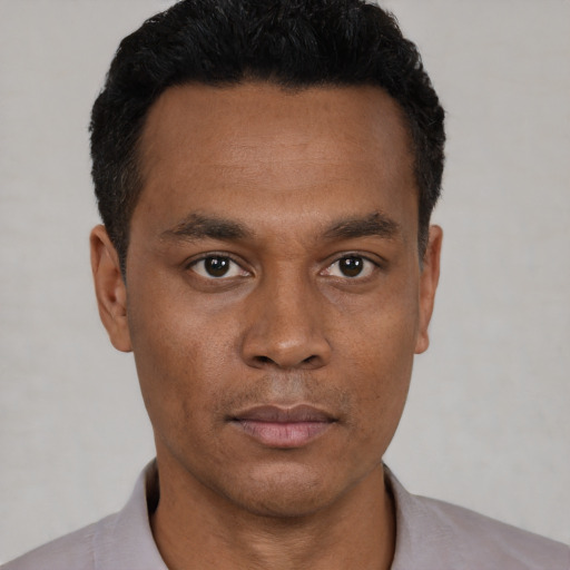 Neutral black young-adult male with short  black hair and brown eyes