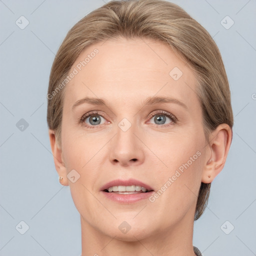 Joyful white adult female with short  brown hair and grey eyes