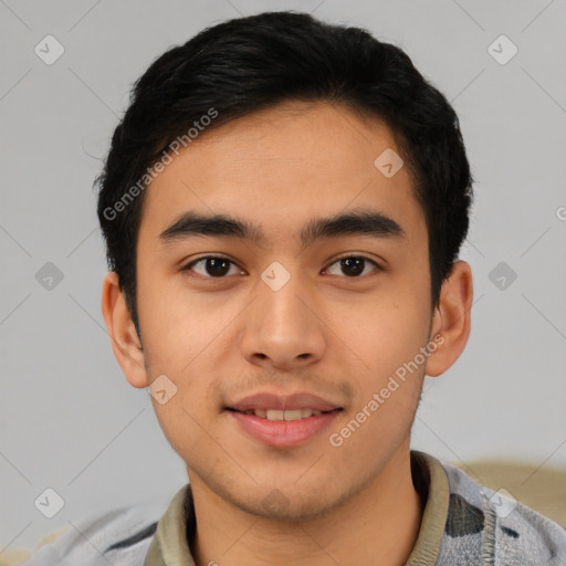 Joyful latino young-adult male with short  brown hair and brown eyes