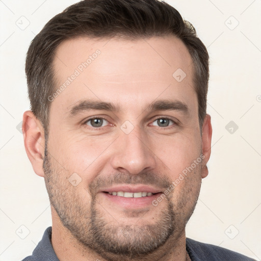 Joyful white adult male with short  brown hair and grey eyes