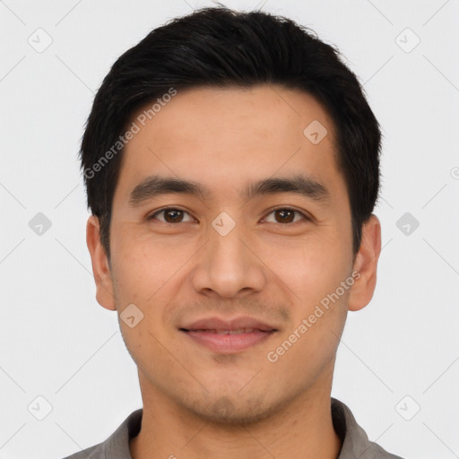 Joyful asian young-adult male with short  black hair and brown eyes