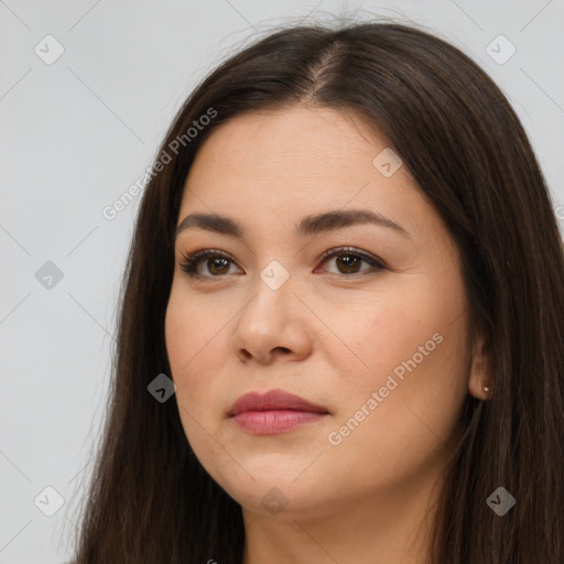 Joyful white young-adult female with long  brown hair and brown eyes