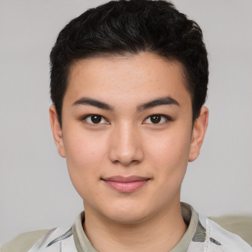 Joyful asian young-adult male with short  black hair and brown eyes