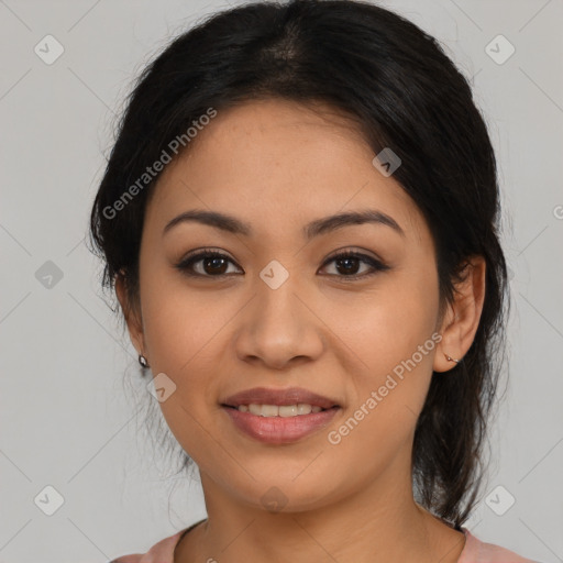 Joyful latino young-adult female with medium  brown hair and brown eyes