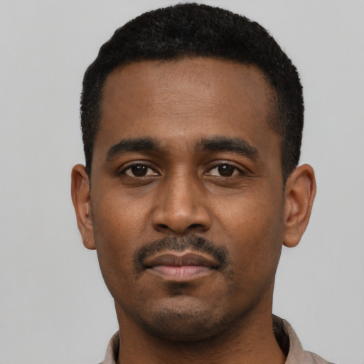 Neutral black young-adult male with short  black hair and brown eyes