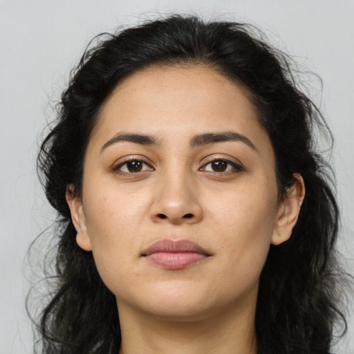 Neutral latino young-adult female with long  brown hair and brown eyes