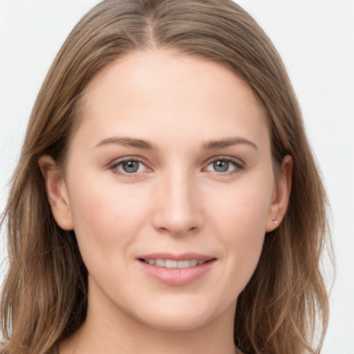 Joyful white young-adult female with long  brown hair and grey eyes