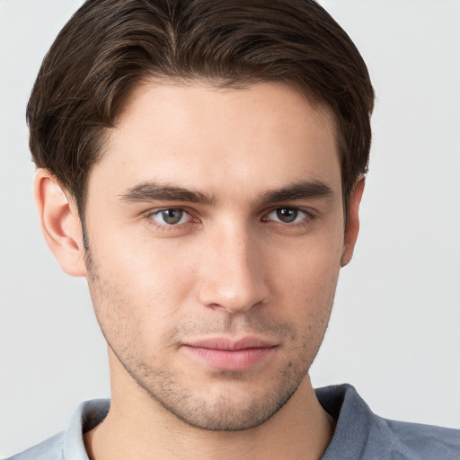 Neutral white young-adult male with short  brown hair and brown eyes