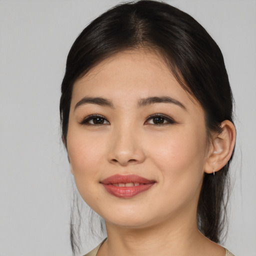 Joyful asian young-adult female with medium  brown hair and brown eyes