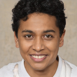 Joyful latino young-adult male with short  brown hair and brown eyes