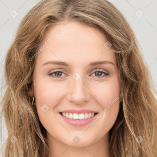 Joyful white young-adult female with long  brown hair and green eyes