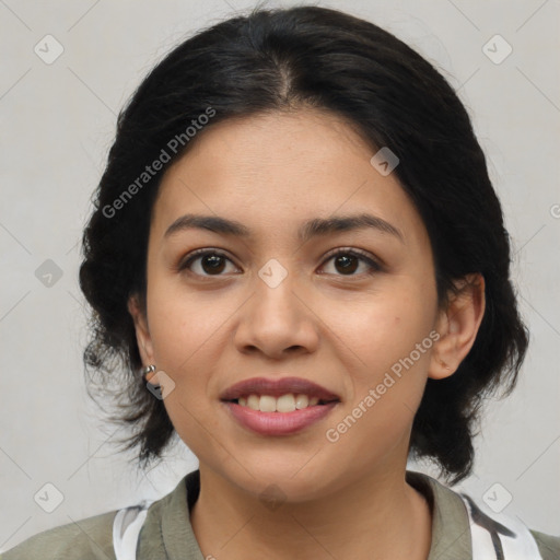 Joyful latino young-adult female with medium  brown hair and brown eyes