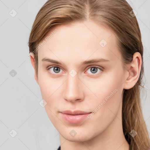 Neutral white young-adult female with long  brown hair and grey eyes