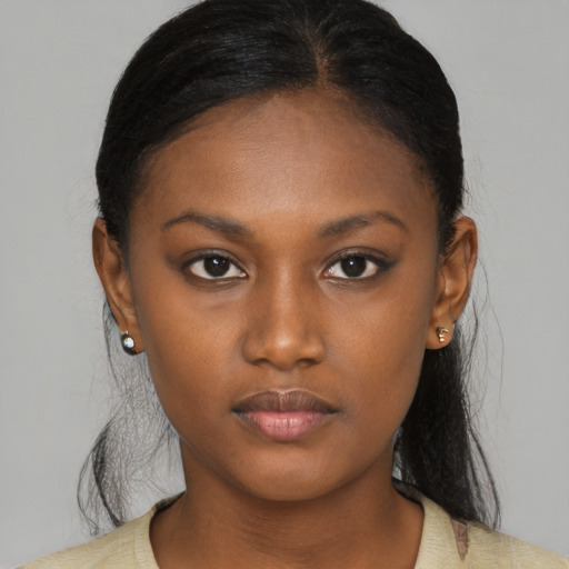 Neutral black young-adult female with medium  black hair and brown eyes