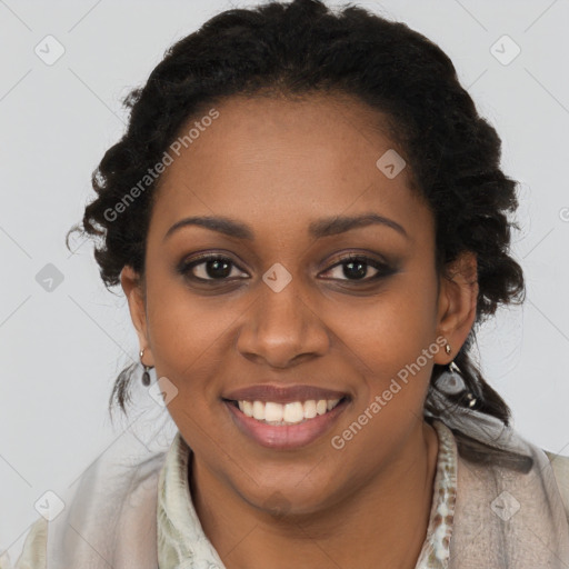 Joyful black young-adult female with long  brown hair and brown eyes