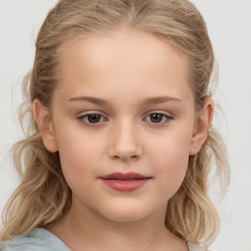 Joyful white child female with medium  brown hair and brown eyes