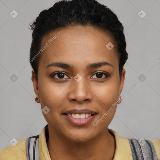 Joyful black young-adult female with short  black hair and brown eyes