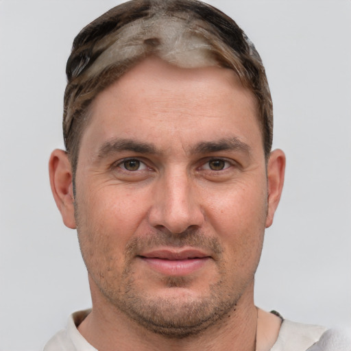 Joyful white adult male with short  brown hair and grey eyes