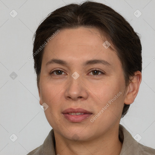 Joyful white adult female with short  brown hair and brown eyes