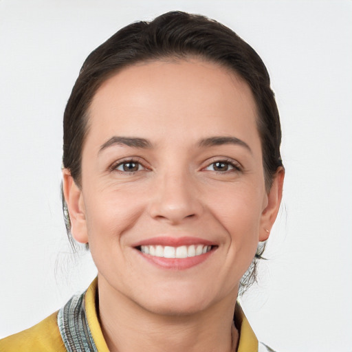 Joyful white young-adult female with medium  brown hair and brown eyes