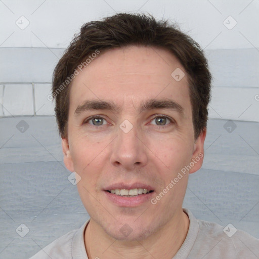 Joyful white adult male with short  brown hair and grey eyes