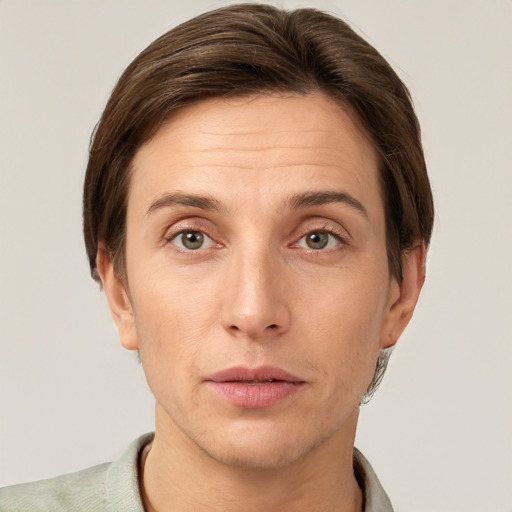 Joyful white adult female with short  brown hair and grey eyes