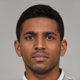 Neutral latino young-adult male with short  black hair and brown eyes