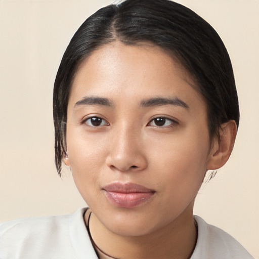 Joyful latino young-adult female with medium  black hair and brown eyes