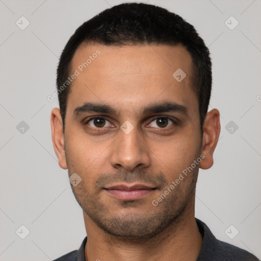 Joyful white young-adult male with short  black hair and brown eyes