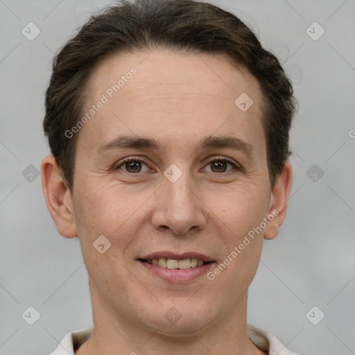 Joyful white adult female with short  brown hair and grey eyes