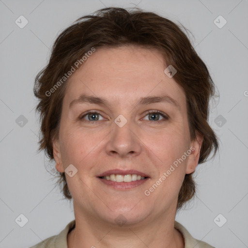 Joyful white adult female with short  brown hair and brown eyes