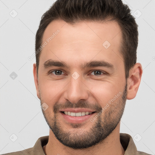 Joyful white young-adult male with short  brown hair and brown eyes