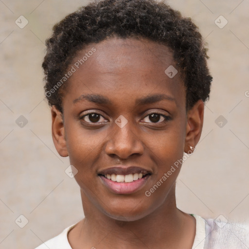 Joyful black child female with short  brown hair and brown eyes